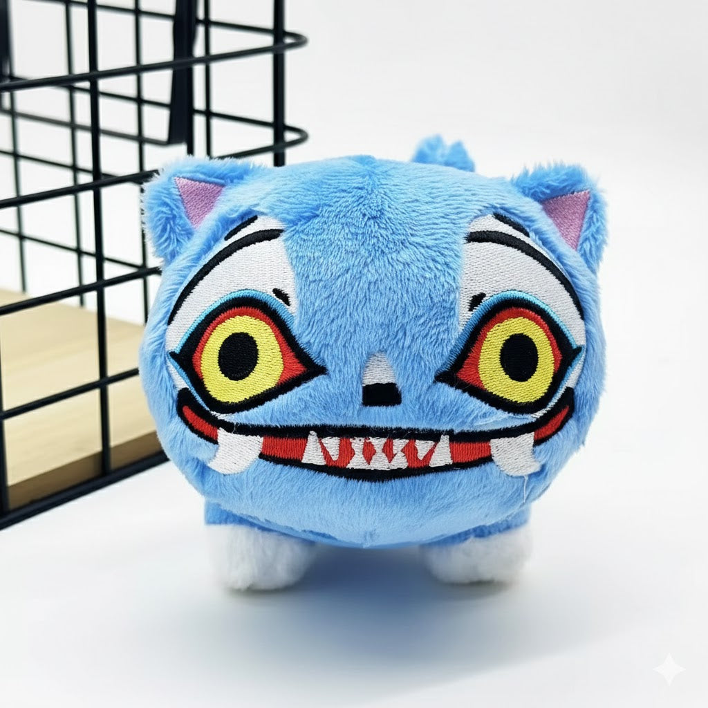 Blue plush toy with a cartoonish face on a white background