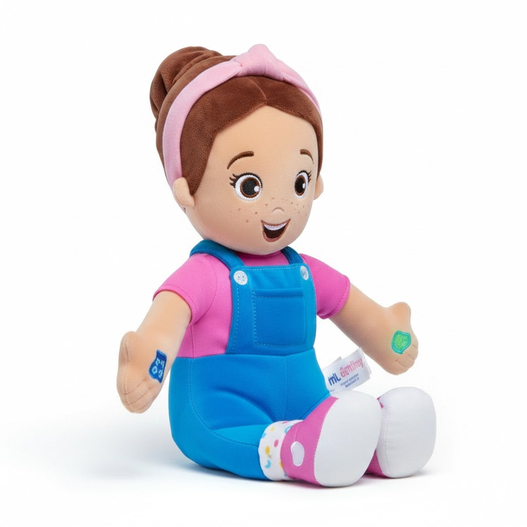 Plush toy doll with brown hair, pink headband, blue overalls, and pink shirt on a white background